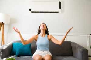 Person enjoying the cool breeze from an AC Princeton, MN