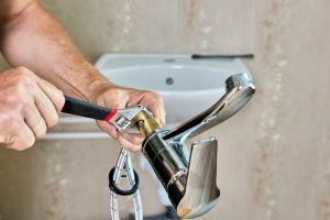 plumber installing new tap in home water supply Zimmerman, MN